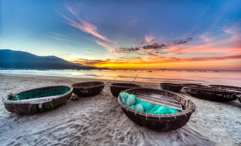My Khe beach is a beautiful beach in Danang city , Vietnam. The sunrise is on creels , ( fishing boats in Vietnam ). My Khe Beach is in Top 6 beautiful beach in the World By Forbes Magazine