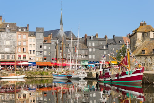 Yachts in the Honfleur harbor in a summer day