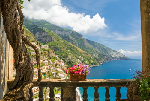 beautiful view of the town of Positano from antique terrace with flowers, Amalfi coast, Italy. balcony with flowers.